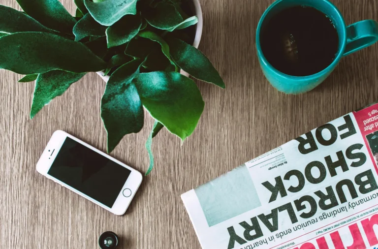 successful-stylish-man-dressed-modern-elegant-clothes-sitting-table-outdoor-cafe-against-background-city-wharf 1